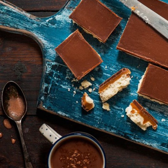 Slices of Chocolate, Caramel, & Biscuit Traybake on a Plate