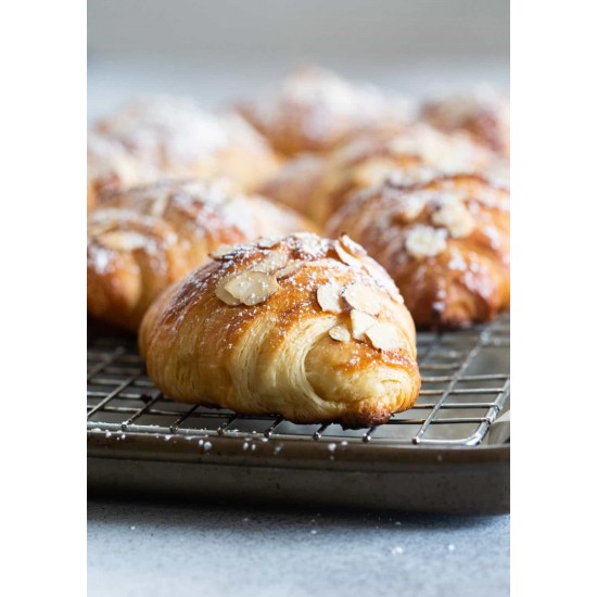 Almond Croissant With Butter on a background