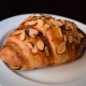 Almond Croissant With Butter on a background