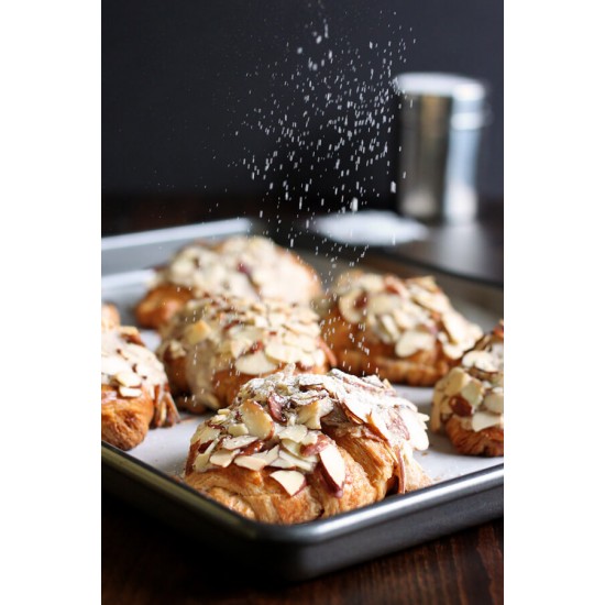 Almond Croissant With Butter on a background