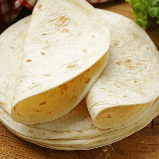 Stack of Plain Tortilla Wraps on a Wooden Board