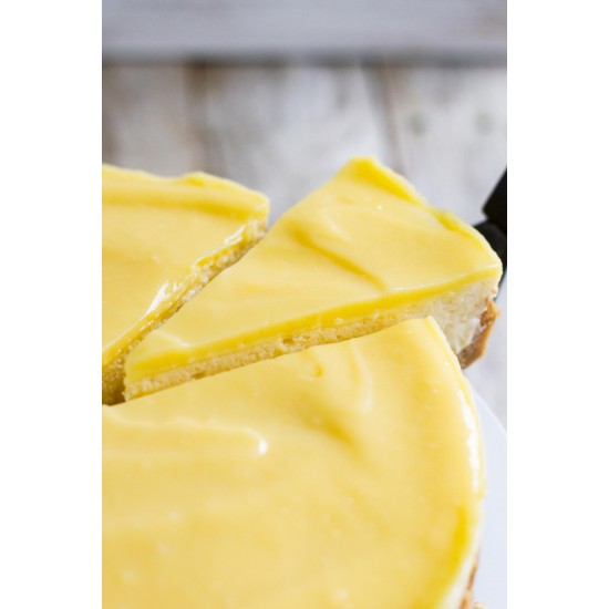 Lemon Cheesecake with One Slice being lifted 