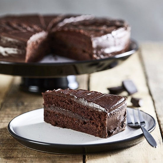 Round Chocolate Cake Standing On A Cake Stand