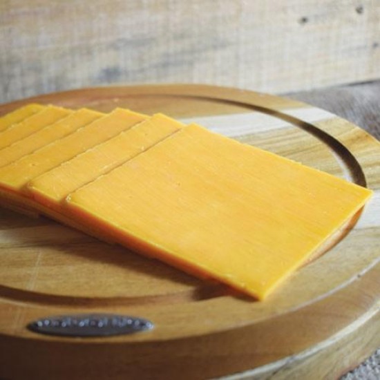 Sliced Red Cheddar on Chopping Board