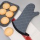 Person wearing Flame Retardant 17'' Charcoal Oven Mitts holding a tray of cookies